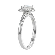 You'll adore the sleek style of this 14k white gold moissanite emerald-cut halo ring. RING DETAILS Width: 9.2 mm. Metal: rhodium-plated 14k white gold Includes: gift box & warranty card By Charles & Colvard  STONE DETAILS Stone type: lab-created moissanite Total weight diamond equivalent: 5/8 ct. Cut:emerald Setting: prong  Diamond equivalent carat (ct.) Total Weight (T.W.) represents the approximate total weight of diamonds of equivalent appearance.Please note, due to the high value of this ite White Emerald Cut Moissanite Halo Ring, Moissanite Diamond Ring With Halo In Emerald Cut, Emerald Cut White Gold Diamond Ring With Halo, White Radiant Cut Wedding Ring With Halo Setting, White Halo Ring Radiant Cut For Anniversary, White Radiant Cut Halo Ring For Anniversary, Classic Platinum Halo Ring With Radiant Cut, White Emerald Cut Halo Wedding Ring, Platinum Baguette Cut Halo Ring