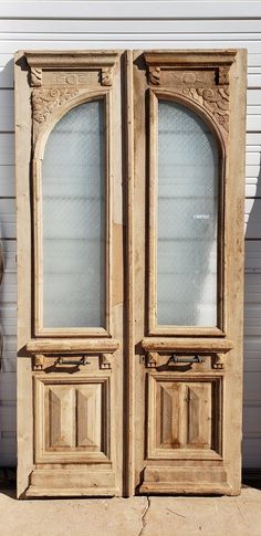 two wooden doors sitting next to each other