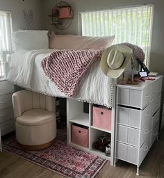 a bedroom with a bed, dresser and hat on it