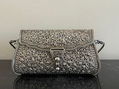 "For your consideration is a fabulous sterling silver .925 clutch handbag. It has a length of 5 5/8\", it is 3\" high and weights 318 grams. The purse is marked .925, and it is in great pre-owned condition. IMPORTANT DISCLAIMERS  We always take plenty of photos and provide detailed descriptions of our items. Therefore, you are asked to please check ALL posted photos and review the Description Section before purchasing an item from our store. Before listing, we clean and inspect our items for neatness and accuracy. However, if a problem with the purchased item arises, we have a very customer friendly return policy. TAXES: In order to comply with recent applicable tax law for marketplace facilitators, Etsy will calculate, collect, and remit sales tax on behalf of sellers for items shipped to Silver Purse, Kawaii Bag, Silver Clutch, Hand Painted Porcelain, Sales Tax, Handbag Purse, Louis Vuitton Speedy Bag, Clutch Handbag, Evening Bags