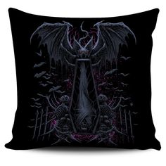 a black pillow with an image of a demon on the front and wings above it