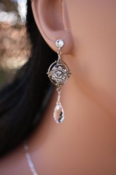 a close up of a person's ear wearing earrings