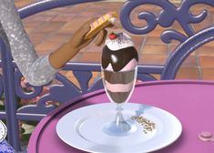 a woman is decorating an ice cream sundae with chocolate and sprinkles