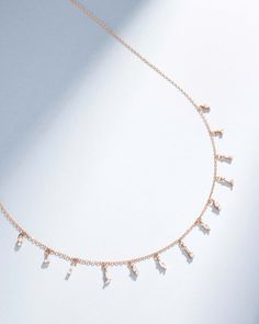 Elevate your look with this exquisite diamond drop necklace. Handcrafted from 18K gold, this necklace features a stunning display of baguette and round white diamonds totaling 0.47 carats, delicately hanging from a chain. This chain necklace is the perfect accessory for any special occasion. Details 18k yellow gold, rose gold or white gold 0.47 carats of baguette and round white diamonds Measures 18" inches in length, adjustable at 16" inches Lobster clasp fastening Ref: BAP364 White Diamond Necklace, Diamond Drop Necklace, Jewelry Tray, Diamond Drops, Rose Gold Necklace, Drop Necklace, White Rose Gold, White Diamonds, Gold Rose