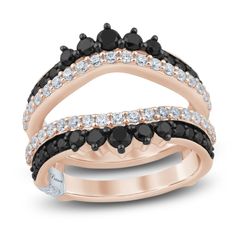 two black and white diamond rings on top of each other, set in 18k rose gold