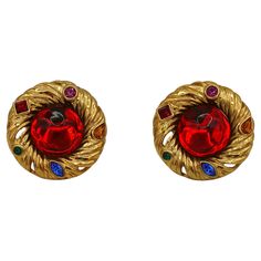 YVES SAINT LAURENT vintage gold toned nest design clip-on earrings embellished with a large red resin cabochon at center surrounded by multicolored crystals. Embossed YSL Made in France. Indicative measurements : diameter approx. 4.5 cm (1.77 inches). Weight : approx. 35 grams per earring. NOTES - This is a preloved vintage item, therefore it might have imperfections. - Colors may differ slightly from actual product appearance due to differences in lighting conditions. - As a buyer, you are full Luxury Vintage Gold-tone Earrings, Paisley Earrings, Ysl Jewelry, 90s Jewelry, Saint Laurent Vintage, Nest Design, Vintage Ysl, Vintage Couture, Couture Runway