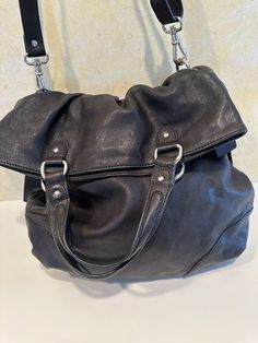 Brand new. Very unusual and cute. Soft leather, has ribbons on sides. New $168. Need to cut security tag out before using, inside seam is location. Crossbody Hobo Bag With Gunmetal Hardware For On-the-go, Crossbody Hobo Bag With Gunmetal Hardware, Travel Hobo Bag With Gunmetal Hardware, Shopping Crossbody Shoulder Bag With Gunmetal Hardware, Everyday Pouch Shoulder Bag With Gunmetal Hardware, Travel Shoulder Pouch Bag With Gunmetal Hardware, Travel Pouch Shoulder Bag With Gunmetal Hardware, Ann Taylor Loft, New Black