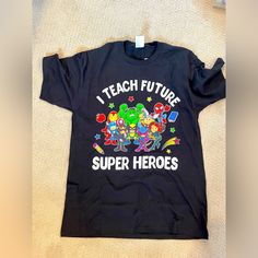 a t - shirt that says i teach future super heros