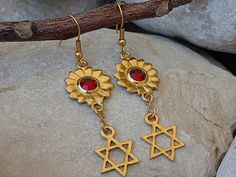 Star Of David Earrings. Gold Jewish Jewelry. Red Swarovski Earrings. Drop Jewish Symbolic Earrings. Magen David Star Charms Jewelry Gift Materials:Metal: 24K gold plated on brass nickel freeGemstone:  swarovski Measurements:Long: 4 cm \ 1.6 InchesThe earrings will be packed in a gift box.Please allow 4-5 days to prepare. I usually ship earlier than this.If you are in a rush, please let me know.FOR MY JEWISH COLLECTION HERE:https://www.etsy.com/il-en/shop/rebekajewelry?section_id=14238096&ref Red Star-shaped Nickel-free Earrings, Nickel-free Red Star Earrings, Red Spiritual Dangle Earrings, Jewish Earrings, Ruby Red Necklace, David Star, Jewish Jewelry, Heart Shaped Necklace, Mothers Necklace