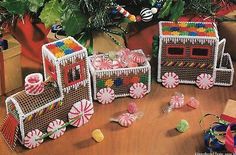 several baskets filled with candy on top of a wooden table