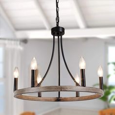 This modern farmhouse dining chandelier has a 59 in hanging chain so you can customize the length to get the perfect height. If you are looking for a ceiling for sloped ceiling, slanted ceiling, flat ceiling, or vaulted ceilings, this wagon wheel chandelier will be a good option. This Lighting Fixtures Hanging can make your home more retro farmhouse style, which is perfect for a farmhouse, dining room, living room, kitchen, barn, living room, entryway, or foyer. Wagon Wheel Light, Brown Farmhouse, Farmhouse Candle, Kitchen Island Dining Room, Island Dining Room, Slanted Ceiling, Farmhouse Candles, Kitchen Island Dining, Retro Farmhouse