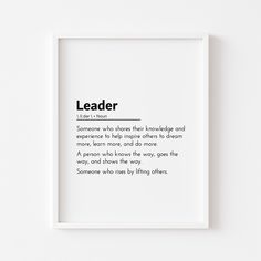 a white framed poster with the words leader on it