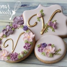 decorated cookies with flowers and the number 50 on them