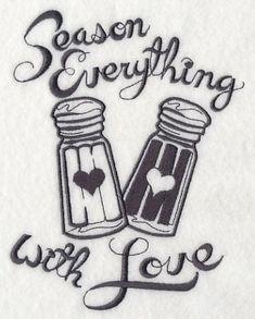 the words season everything with love written in black ink on a white towel, next to two salt and pepper shakers