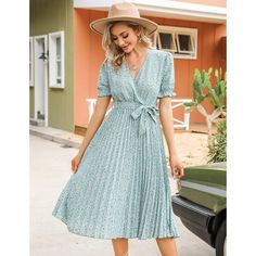 This women's summer beach dress is made from soft, comfortable, and breathable fabric ideal for summer wear. It features a wrap V-neck, printed design, pleated details, short lantern sleeves, elastic high waist, A-line silhouette, elegant hem, and belt for a casual yet elegant look. Suitable for various occasions like school, work, beach outings, weddings, and more, the dress can be dressed up or down for a lively and elegant appearance. Pair with high heels, wedges, flats, or sandals for a styl Green Floral Print V-neck Dress For Summer, Summer V-neck Knee-length Dress For Brunch, Pleated Summer Beach Dress, Pleated Beach Dress For Summer, Green Pleated Midi Maxi Dress, Vacation V-neck Pleated Midi Dress, Green Bohemian Midi Dress For Summer, Bohemian Green Midi Dress For Summer, Fitted Midi Length V-neck Dress For Beach