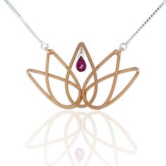 Symbolic of purity, harmony, and rising above adversity, Heartstrings' Lotus Flower Necklace portrays the natural relationship between strength and beauty. Fashioned of phosphor-bronze guitar string, the stand alone beauty of the lotus is only enhanced by a glimmering drop of rubellite. This breathtaking tribute to a life with purpose dazzles against a fully adjustable, easy-to-wear Italian sterling silver chain. The strings for Lotus undergo an innovative in-house coating process to assure thei Celtic Braid, Guitar String Jewelry, Guitar String Bracelet, Lotus Flower Necklace, Rising Above, Red Tourmaline, Heart Strings, Necklace Red, Gold Jewelry Necklace