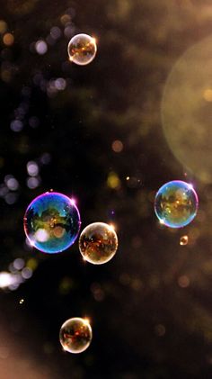 soap bubbles floating in the air on a sunny day