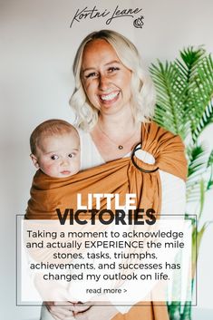 a woman holding a baby in her arms with the words little victorias on it