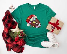 Christmas Football Shirt, Xmas Football T-shirt, Winter Sports Tee, Santa's Footballer Shirt, Family Football T-shirt, Christmas Ball Tee Hello!! We wish everyone to smile with our cute, stylish, and trendy graphic shirts. We assure you these shirts are the perfect gifts whether you buy them for yourself or someone else. Please, check the size chart before you purchase. HOW TO MAKE AN ORDER * Pick your shirt type and size Your design will be printed on the front. *Pick your shirt color Add your design Name If Your Order Customized PRODUCTION Processing time is 1-3 business days. For rush orders please contact us first. SHIPPING Domestic Shipping First Class 2-5 Business days Priority Mail 1-3 Business days Express Mail 1-2 Business days MATERIAL CARE Turn inside out. Cold Wash Do not bleac Nfl Christmas, Cocoa Christmas, Balls Shirt, Christmas Tree Shirt, Sports Tee, Mama T Shirt, Christmas Gnomes, Merry Christmas Shirts, Basketball Mom