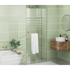 a green tiled bathroom with a sink, toilet and shower