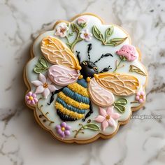 a decorated cookie with a bee on it