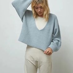 With A Thick Cuff, Blouson Sleeve, And Oversized Fit, This Pullover Hangs Just Right No Matter What You Pair It With. Reversible For Two Different Looks (V-Neck Or V-Back), Wear It Over A Bodysuit, Or Off The Shoulder The Possibilities Are Endless. Composition: 65% Organic Cotton, 24% Nylon, 10% Silk, 11% Elastane Brand New In Plastic Packaging. Blue Ribbed Cropped Sweater For Spring, Blue Cropped Sweater With Ribbed Cuffs For Fall, Blue Ribbed Long Sleeve Cropped Sweater, Oversized Blue Cropped Sweater, Blue Ribbed Cropped Sweater For Fall, Chic Blue Cropped Sweater For Fall, Light Blue Tops With Ribbed Cuffs For Fall, Fall Blue Ribbed Cropped Sweater, Light Blue Fall Tops With Ribbed Cuffs