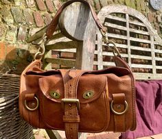 Beautiful natural vegetable tanned leather in a warm dark tan with brass hardware, unlined, exterior pocket with 2 postmans locks ,one internal zipped pocket with Mulberry cotton lining. Width 28cm Height 38cm Depth19cm. Cognac Satchel Shoulder Bag With Brass Hardware, Vintage Satchel Shoulder Bag With Pockets, Vintage Cognac Soft Leather Satchel, Brown Satchel Shoulder Bag With Brass Hardware, Classic Brown Shoulder Bag With Pockets, Vintage Brown Flap Satchel, Brown Flap Bags With Brass Hardware, Brown Flap Shoulder Bag With Brass Hardware, Brown Satchel With Brass Hardware