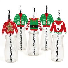 christmas sweaters and hats are in glass jars with straws to drink from them