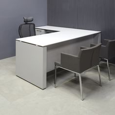 an office desk with two chairs in front of it and a chair next to it