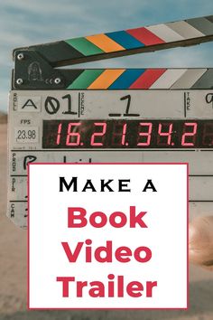 a person holding up a book with the title make a book video trailer on it