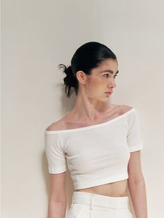 Editor's Notes Soft and stretchy, this layered crop top is made with two separate panels- sleeveless tank top and off-shoulder short sleeves. Wear them alone or layer together for unique, versatile mood. - Lightweight cotton blend fabric- Subtle ribbed texture throughout- Trendy cropped length- Ribbed finishes at edges- Asymmetrical hem design- Versatile 2-way stylingMeasurements(in.)Size (S/M)- Shoulder: 8.27 in / 8.86 in - Bust (Tank top): 14.76 in / 15.75 in - Bust (Inner top): 13.58 in / 14.57 in - Hem (Tank top): 12.40 in / 13.39 in - Hem (Inner top): 11.81 in / 12.60 in - Sleeve: 6.69 in / 6.89 in - Length: 15.75 in / 16.14 in * Model info: Height 5' 7 Bust 31.5 Waist 23 Hips 34, wearing Size S / Height 5' 5 Bust 30 Waist 23 Hips 34, weari Scoop Neck Fitted Crop Top For Summer, Fitted Scoop Neck Crop Top For Summer, Seamless Short Sleeve Tops For Summer, Stretch Slightly Cropped Summer Crop Top, Stretch Scoop Neck Crop Top For Summer, Summer Cropped Fitted Tank Top, Cropped Fitted Tank Top For Summer, Seamless Off-shoulder Crop Top For Summer, Fitted Short Sleeve Seamless Crop Top