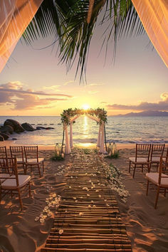 an outdoor wedding setup on the beach at sunset