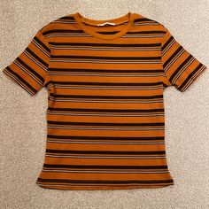 This Ribbed And Striped Medium Zara Tee Is Nwot. It’s In Perfect Condition But The Inside Tag Has Been Removed. Really Comfortable Material That Can Be Dressed Casually Or Up Because Of The Nice Ribbed Quality. Though Size Medium, It Is Meant To Have A Snug Fit. It’s A Beautiful Deep Ochre, Almost Orange. Autumn Fits, Dream Clothes, Orange White, Zara Tops, Orange Yellow, Striped Shirt, Black Tee, Snug Fit, White Black