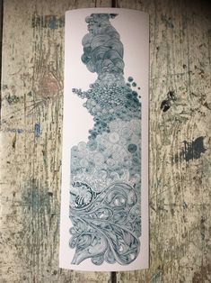 a bookmark with an image of a woman's head and flowers on it