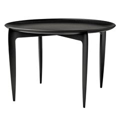 a black table with two legs and a small round tray on the top that is shaped like an oval