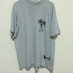 Brand : Stussy Good condition Pre-owned 8.5/10 Size : L Pit to pit : 21 inches Length : 27.5 inches Colour : Gray Style : Vintage tee Pre-owned and used vintage products Not return and refund, So please read a detail before completing purchase Payment : accept paypal only Shipping worldwide by registered airmail (small package) Thai post registered. receiving the item within 7-30 business days non sat-sunday working after payment cleared  (some case in Australia/italy/spain/north and south america 2-4 weeks) I ship every day, Monday through Friday! Many times your item will go out same day!! Get your stuff super fast when you buy from me Check item status out of my country in http://track.thailandpost.co.th 90s Style Gray Graphic Print Top, 90s Gray Graphic Print Top, Gray Y2k T-shirt For Streetwear, Gray Y2k Style T-shirt For Streetwear, Colour Gray, Vintage Products, North And South, North And South America, Vintage Tee