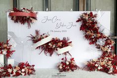 the wedding sign is decorated with flowers and ribbons