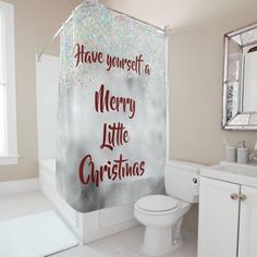 a merry little christmas shower curtain in a bathroom