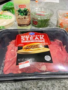 the meat is ready to be put into the oven for baking and other ingredients are on the counter