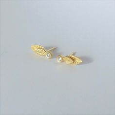 "These are elegant stud earrings, inspired by leaves. They are great to wear every day but look very fine and prestigious with sparkling diamonds*. They are made of 14k gold stamped 14k on the backside and have an elegant matte finish. You have to choose which color 14k gold you want the earring to be- yellow or white. I plate the white gold in rhodium plating, as is common in white gold jewelry.  The size of each earring Is 0.58 \\ 0.23 inches ( 1.5 \\ 0.6 cm ) These are \"made to order\" earri Elegant Leaf Shaped Earrings As Gift, Elegant Leaf-shaped Earrings For Gift, Nature-inspired Gold Earrings For Anniversary, Order Earrings, Woodland Earrings, Woodland Wedding, White Gold Jewelry, Sparkle Diamonds, Real Diamonds