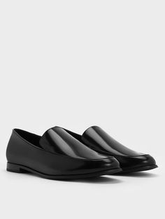 It does not get more classic than these loafers. They feature an almond-toe silhouette, a streamlined design, and a timeless black finish, exuding a chic, androgynous appeal. The 1.5cm block heels provide extra sturdiness and reliability while offering a slight lift. With unparalleled versatility, these loafers will complement everything in your wardrobe, making them perfect for everyday wear. For a trendy twist, pair them with classic white crew socks. Classic Flat Slip-ons For Business, Formal Slip-on Flats With Plain Toe, Sleek Slip-on Formal Flats, Sleek Loafers With Leather Sole And Flat Heel, Sleek Pointed Toe Loafers With Branded Insole, Sleek Business Flats With Rubber Sole, Sleek Almond Toe Loafers With Rubber Sole, Sleek Almond Toe Flats For Formal Occasions, Sleek Almond Toe Formal Flats