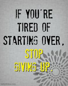 a sign that says if you're tired of starting over, stop giving up