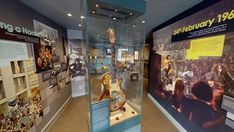 the museum displays many different types of musical instruments and music memorabilia in glass cases on display