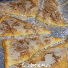 some food that is sitting on top of a pan with powdered sugar over it