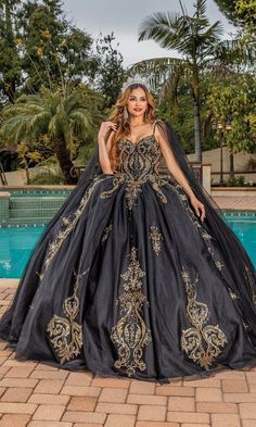 Black quinceanera a-line ball gown with gold lace embroidery and sweetheart neckline. Black And Gold Wedding Dress, Quinceanera Dresses Black, Vestido Charro, Gown With Cape, Feeling Secure, Black Quinceanera Dresses, Quinceanera Dresses Gold, Cape Gown, Quince Dress