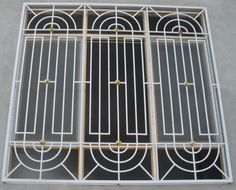 a window with bars and circles on it