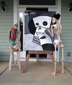 two skeletons are standing in front of a painting on the porch and one is holding a skeleton