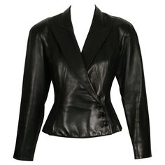 Jet-black, butter-soft leather jacket designed by Azzedine Alaia dating to late 1980's. Jacket has a very flattering silhouette with a fitted waist, slightly flared hemline and beautiful topstitched seams. Labeled a French size 38. Approximate measurements: shoulder 16", bust 34", waist 28.5", arm length from shoulder seam to cuff 23" and overall length at center back (with collar) 22". Button closure. Fully lined. Made in France. Very good condition. Slim Leather Jacket, Alaïa 90s, Alaia Jacket, Vintage Alaia, Alaia Leather Jacket, Alaia Spring 1991, Azzedine Alaia, Ann Demeulemeester, Black Leather Jacket