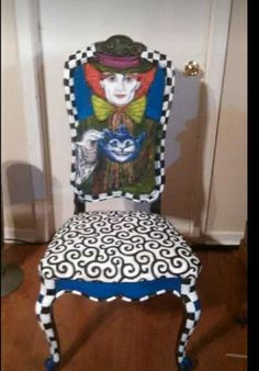 a chair that has been painted with an image of a clown on it