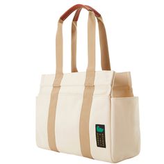 Everyday Essentials   Every day is an adventure with this lightweight 100% Egyptian cotton canvas tote, woven in Italy and featuring various pockets to keep you organized everywhere you go. Functional Beige Cotton Canvas Bag, Beige Functional Canvas Bag, Cotton Canvas Bag With Leather Handles For Weekend Trips, Beige Bags With Functional Pockets For Everyday Use, Daily Use Cotton Bags With Functional Pockets, White Canvas Diaper Bag For Travel, Cream Canvas Bag With Pockets, Beige Duck Canvas Bag For Travel, Everyday Cotton Bags With Functional Pockets